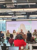 Group of investors talking on a panel at an event