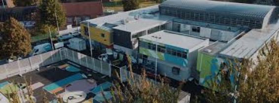 An ariel photo showing the external sports facilities and size of building