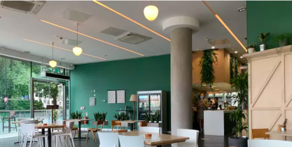 Seating inside the cafe with chairs, tables and a countertop
