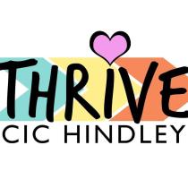 Graphic design showing the logo of the organisation. It says 'Thrive CIC Hindley' in black bold letters and it goes with three arrows in the background on different colours. A big pink heart is topping the "i" letter on "Thrive".